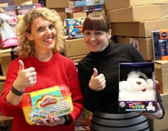 Giving Back Charity Members Helen Walton (left) and Caroline Wolfenden helping sort the gifts last year, when over 2,300 were donated and delivered locally