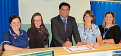 Vicky Riding from Bardoc and Dr Chauhan are joined by Senior Sister Vivienne Simpson, Doctor Andrea Abbas and Emily Jackson from Fairfield General Hospital to sign the pledge