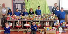 Belfield School pupils with Iain Wight and Margaret Ogden of Rochdale Foodbank