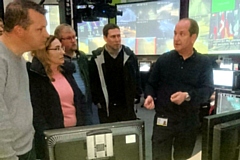 Highways England's control room team manager Neil Lloyd (far right) talks 'signs and signals' with approved driving instructor visitors