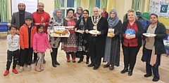 Mayor Mohammed Zaman (centre) with participants at the food festival