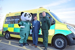 North West Ambulance Charity Development Manager, Vincent Sherard-Bornshin (centre), with mascot Pandamedic (left) and David McNally, Community Engagement and Resuscitation Manager at North West Ambulance Service (right)