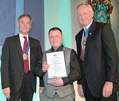 Stuart Smith (centre) collects his award at the Plaisterers’ Hall, London