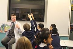 Teacher Chris Lowe with pupils 