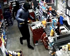 CCTV from an armed robbery at the Castleton Co-op in 2018