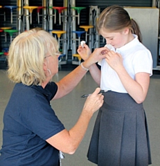 A Norden Primary School pupil receives a sticker after her flu vaccination