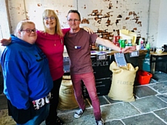 Pantry volunteers Kim, Sandra and Andy