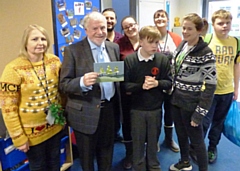 Council leader Allen Brett with competition winner Callum and his classmates and teachers at Redwood School in Rochdale.