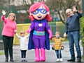 Twins Poppy-Anne and George Dale taking Grandma, Grandad and Rochelle the Healthy Hero for a toddle at the Heywood launch 