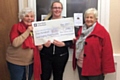 A cheque for the funds was presented by Sarah Briggs to Susan Coates and Christine Downham Clarke, both of the Foodbank