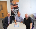 NHS HMR CCG Chief Officer Simon Wootton and NHS HMR CCG Chairman and local GP Dr Chris Duffy signing the NHS Smokefree Pledge, with ex-smoker Dave Gorner 