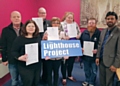 Mohammed Sarwar presents the Lighthouse Project members with their Diabetes Course Certificates