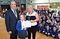 Councillor Kieran Heakin, Kelsie Parkinson with her eco superstar award and Karen Bracken, school business manager