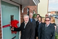 Rochdale council leader, Allen Brett, cuts the ribbon at Mill Gardens