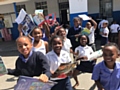 Children with the English language books donated as part of the ‘Help a South African School’ scheme