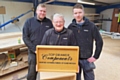 Brian (centre) celebrated his 80th birthday with his work colleagues