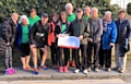 Presenting the cheque were Mike’s widow, Andrea, veteran runner Roger Colson and race organiser, Andy O’Sullivan