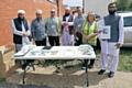 Rochdale Council's recycling team working with local community members and leaders outside Neeli Mosque