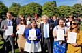 Young people receive their Gold Duke of Edinburgh Award from John Suchet