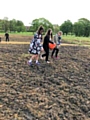 Students from Redwood Secondary School sowing wildflower seeds in Denehurst Park