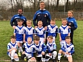 Mayfield Mustangs U7s showing off their new kit before a recent game, with Coach Craig Kopczak of the Salford Red Devils.