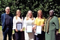 Daniel Benjamin (left), Non-Executive Director, and Evelyn Asante-Mensah OBE (right), presenting Long Service Awards to Pennine Care staff