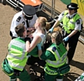 A young woman is treating for heat exhaustion