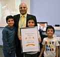 Nadeem Talib and his family accept his Community Learning Award