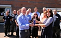 RBH repairs manager, Peter McHugh, receives the accreditation award from HQN’s Gill Stead