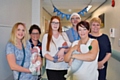 Amy Carlon with baby Freya, Mel Wildman (ward manager), Jennie Andrews with baby Teddie, Simon Mehiga (head of midwifery), Nicola Firth (director of nursing/chief officer) and Fay Read with baby Theo