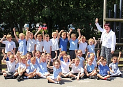 Big cheer as pupils at Smithy Bridge Primary School celebrate naming one of the Peregrine Falcon Chicks, with Councillor Janet Emsley 