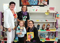 Four-year-old Esme Bond with Councillor Janet Emsley, Joanna Yeomans and Michelle Krauza (both from the council's library service) 