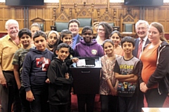 Rochdale Council Leader Councillor Allen Brett, Councillor Liam O'Rourke and Rochdale MP Tony Lloyd with pupils from Broadfield Primary School at Rochdale Town Hall 