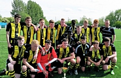 Hopwood Hall College's football team pose with the County Cup