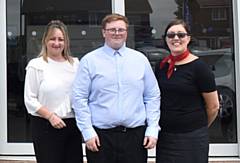 Bradley Taylor and his managers at RRG Peugeot Oldham 