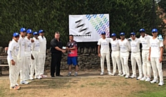 Dexter Fitton of Hanson Springs hands the sponsorship cheque to touring coach Asif Mujtaba who was professional at Norden for 11 years, watched by the Dallas Knights under 17s players