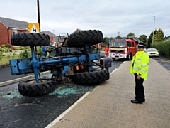 A tractor carrying goats overturned