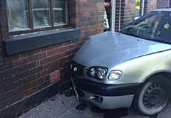 One car collided with a house