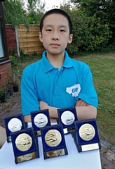 Xaunming Guo with his medals from the County Inter Association Swim Meet in June