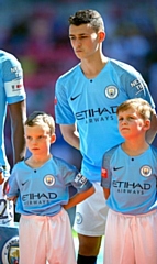 Dylan McLachlan (left) at Wembley Stadium as a player escort for Phil Foden ahead of Manchester City winning the Community Shield for 2018