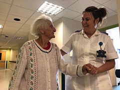 Lynette Cook, activities co-ordinator on Wolstenholme Unit, helping a patient