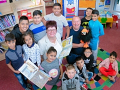 Councillor Janet Emsley with children and Ray Stearn at Smallbridge Library 