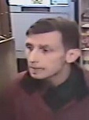 Police have released the image of a man they want to speak to following a robbery at a newsagents in Heywood