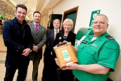 Gary Mills, Shaun Ingram, Mark Farmer, Kath Tunstall and Ian Gardener with the Morrisons in-store defibrillator