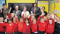 Castleton Primary School children celebrate their library tickets Councillors Janet Emsley, Billy Sheerin; Jean Hornby; Aasim Rashid and Michelle Krauza from the council library service