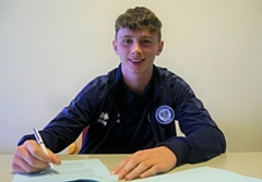 Daniel Adshead signing his first professional contract at Rochdale AFC in September 2018