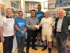 Mike Goldrick (centre) presents a cheque to Ken Horan (second right), joined by Paul Mullen (back) and Rotarians Peter Gilmartin, Toni Fletcher (left) and Edwin Partridge (far right)