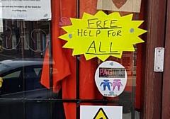 A Kid Safe Zone image displayed in the window of the Parents Against Grooming UK walk-in centre on Yorkshire Street, Rochdale