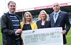 Representatives from Rochdale Children's Moorland Home with their cheque