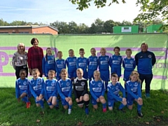 St Luke's pupils show off their new kit, sponsored by PLP